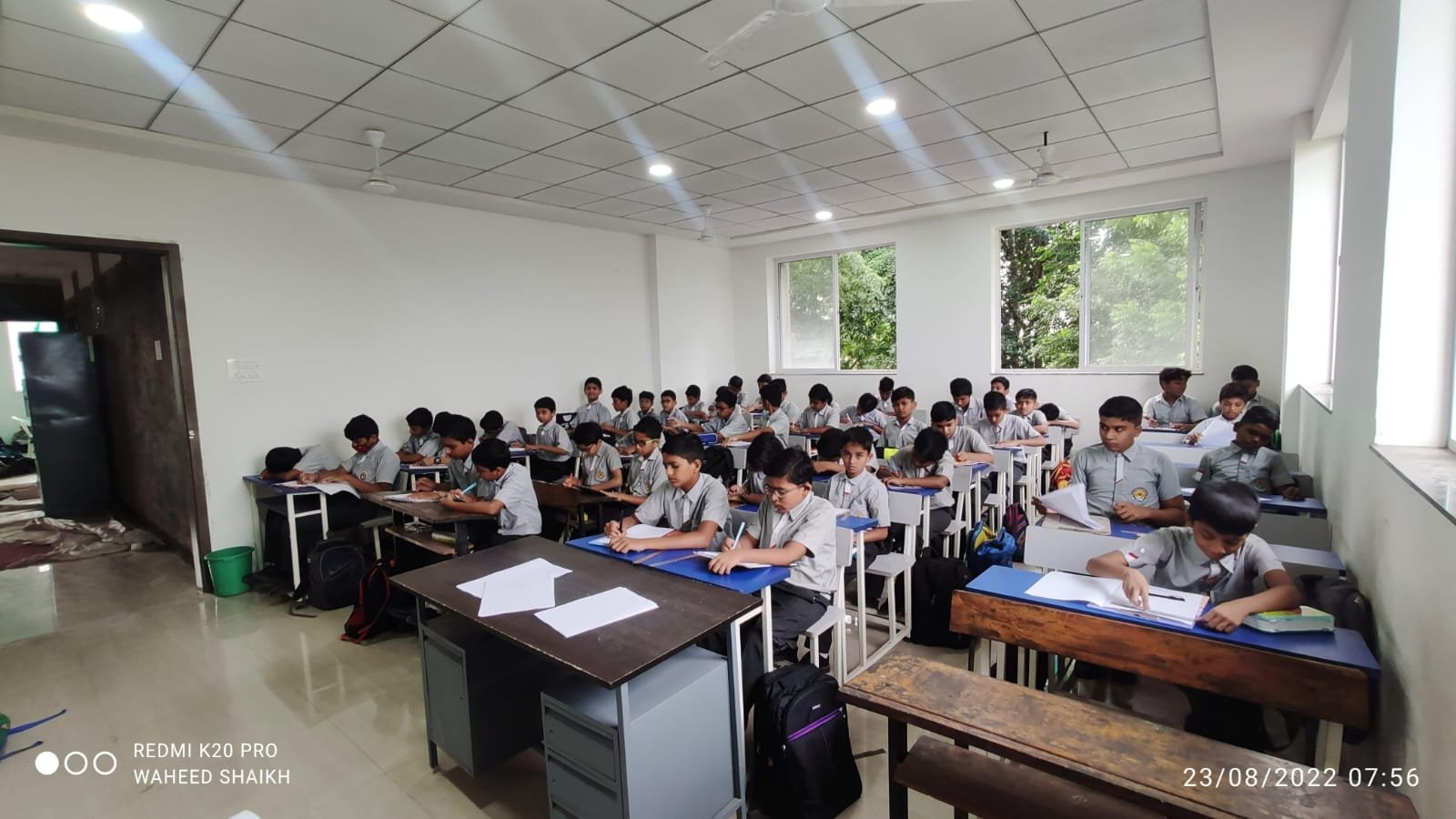 Students walking through a school corridor